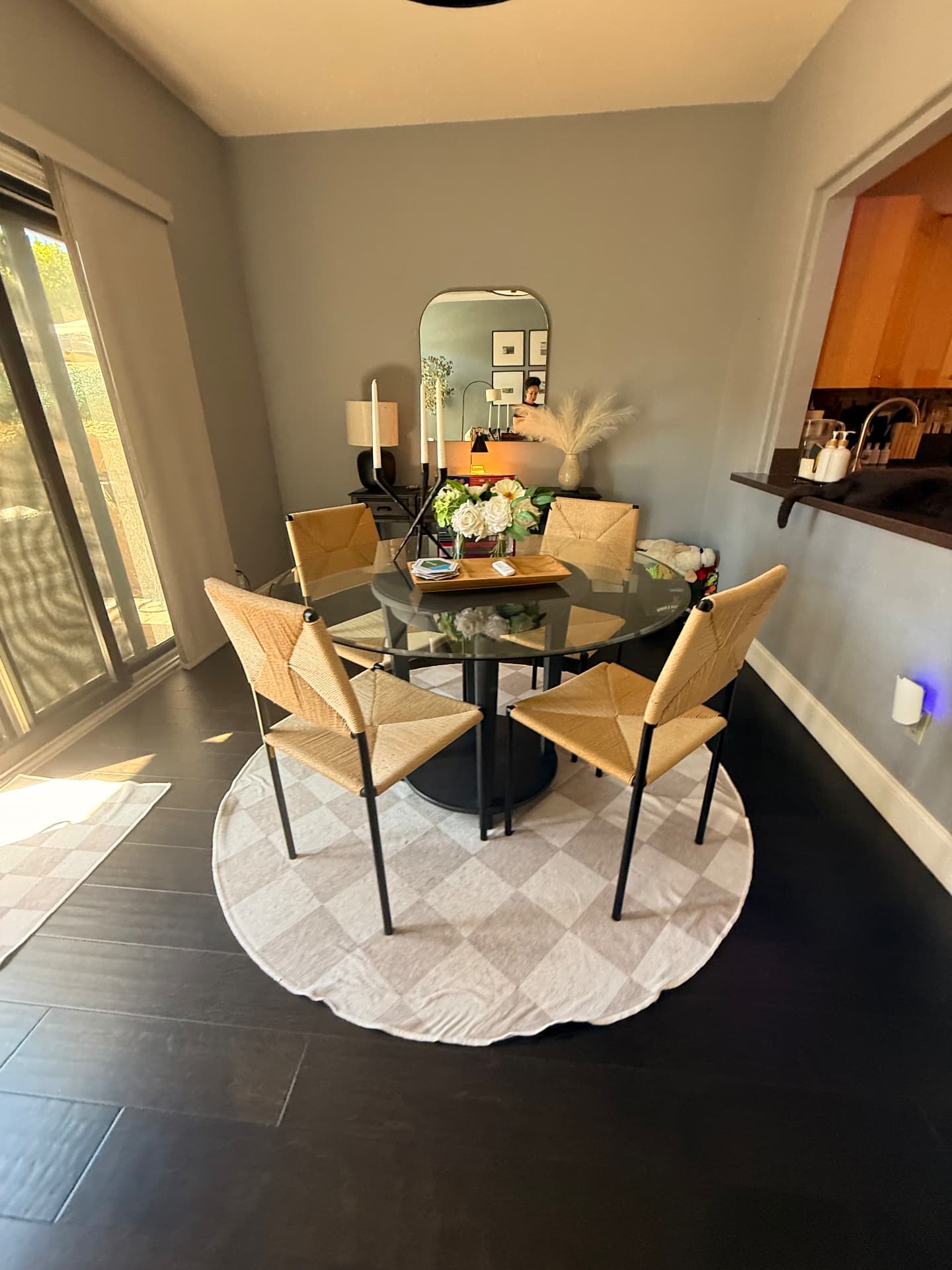Dining area with glass table and detailed chairs after a Lustre Haus clean in Gilbert